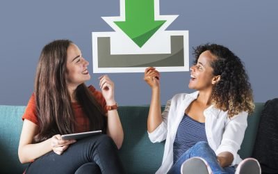 Young female friends holding a download icon